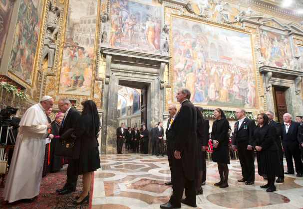 Pope Francis greets ambassadors during an audience with the diplomatic corps at the Vatican