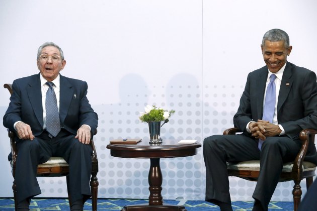 Obama smiles during a meeting with Castro during the first plenary session of the Summit of the Americas in Panama City, Panama