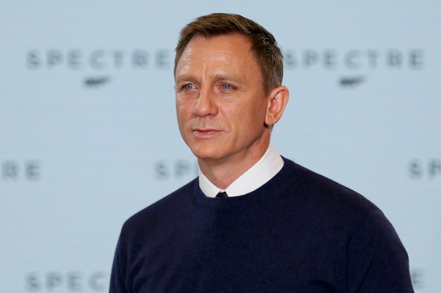 Actor Daniel Craig poses on stage during an event to mark the start of production for the new James Bond film "Spectre" at Pinewood Studios