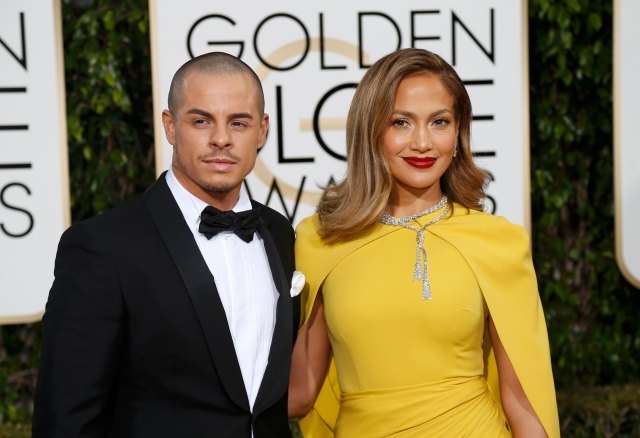 Actors Casper Smart and Jennifer Lopez arrive at the 73rd Golden Globe Awards in Beverly Hills, California January 10, 2016. REUTERS/Mario Anzuoni