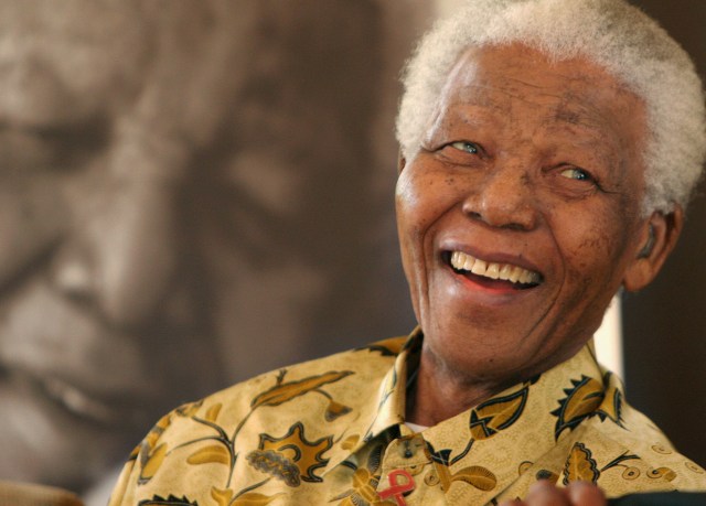 Former South African President, Nelson Mandela, in a jovial mood at the Mandela Foundation in Johannesburg Wednesday, Dec. 7, 2005 where he met with the winner and runner-up of the local " Idols" competition. The 87-year-old former political prisoner who became the country's first black president in 1994 remains a popular high profile figure since retiring from public life in recent years. (AP Photo/Denis Farrell)