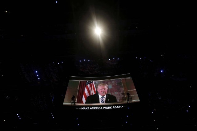 Republican presidential nominee Donald Trump appears on a video screen at the Republican National Convention in Cleveland, Ohio, U.S. July 19, 2016.  REUTERS/Mike Segar