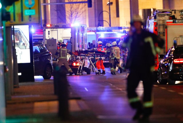 Paramedics work at the site of an accident at a Christmas market in Berlin