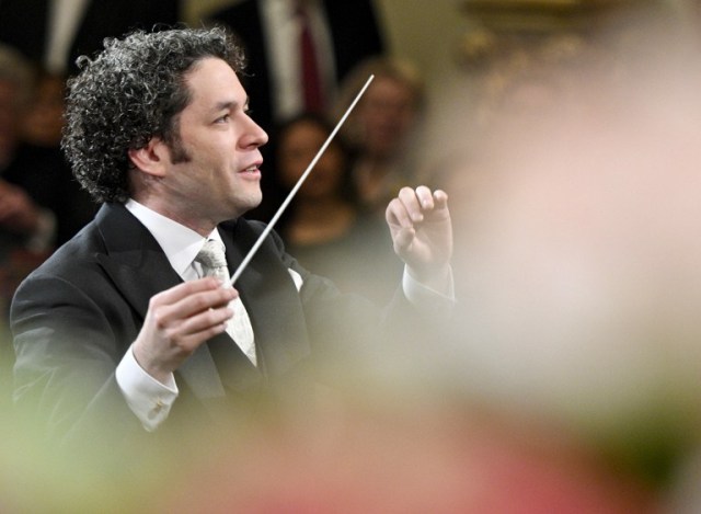 Venezulean conductor Gustavo Dudamel conducts the traditional New Year's Concert 2017 with the Vienna Philharmonic Orchestra at the Vienna Musikverein in Vienna, Austria, on January 1, 2017. / AFP PHOTO / APA / HERBERT NEUBAUER / Austria OUT