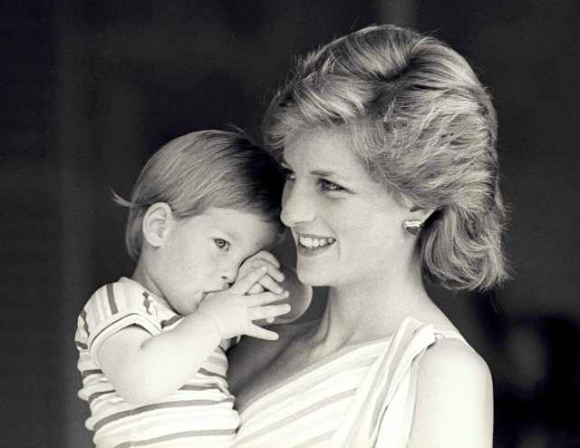 FILE PHOTO - Britain's Princess Diana holds Prince Harry during a morning picture session at Marivent Palace, where the Prince and Princess of Wales are holidaying as guests of King Juan Carlos and Queen Sofia, in Mallorca, Spain August 9, 1988. REUTERS/Hugh Peralta/File Photo
