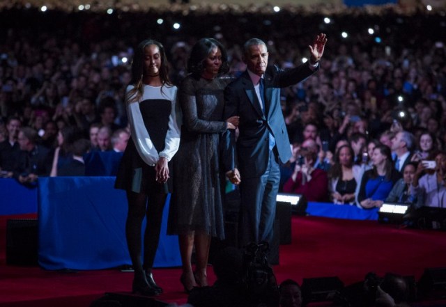 CHICAGO, IL - JANUARY 10: U.S. President Barack Obama, first lady Michelle Obama and daughter Malia Obama wave goodbye to supporters after Obama's farewell address at McCormick Place on January 10, 2017 in Chicago, Illinois. Obama addressed the nation in what is expected to be his last trip outside Washington as president. President-elect Donald Trump will be sworn in as the 45th president on January 20. Darren Hauck/Getty Images/AFP