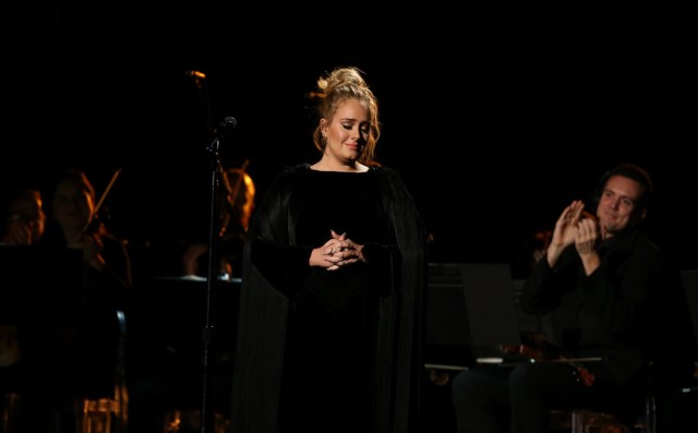 Singer Adele is applauded as he finishes her tribute to the late George Michael at the 59th Annual Grammy Awards in Los Angeles, California, U.S. , February 12, 2017. REUTERS/Lucy Nicholson
