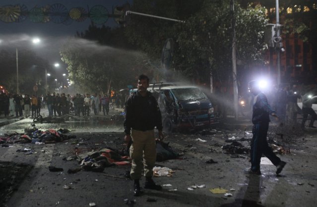 ATTENTION EDITORS - VISUAL COVERAGE OF SCENES OF INJURY OR DEATH A policeman stands guard at the scene after a blast in Lahore, Pakistan February 13, 2017. REUTERS/Mohsin Raza TEMPLATE OUT