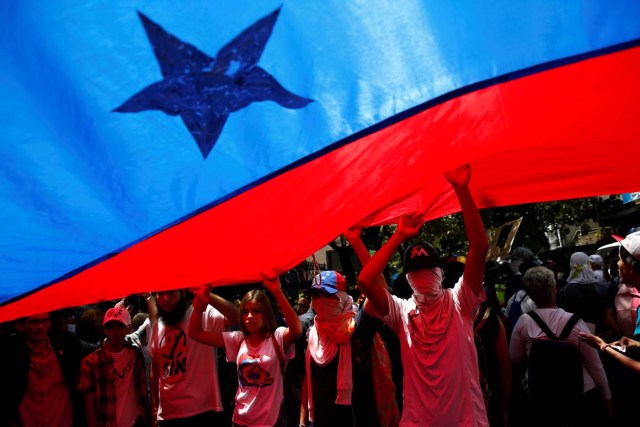 Demonstrators attend a rally against Venezuela's President Nicolas Maduro's government in Caracas, Venezuela June 27, 2017. REUTERS/Ivan Alvarado