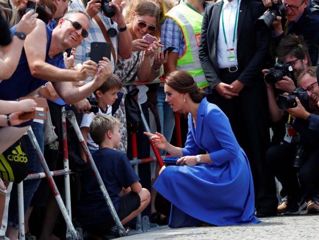 Catherine, The Duchess of Cambridge chats with children as she visits the Brandenburg Gate in Berlin, Germany, July 19, 2017. REUTERS/Fabrizio Bensch