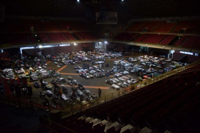 Residents seek shelter inside Roberto Clemente Coliseum in San Juan, Puerto Rico, early on September 20, 2017, as Hurricane Maria passes the island. Hurricane Maria closed in on the Virgin Islands and Puerto Rico on September 20 as forecasters warned of a "potentially catastrophic" storm that has already killed at least two people in the Caribbean. / AFP PHOTO / HECTOR RETAMAL