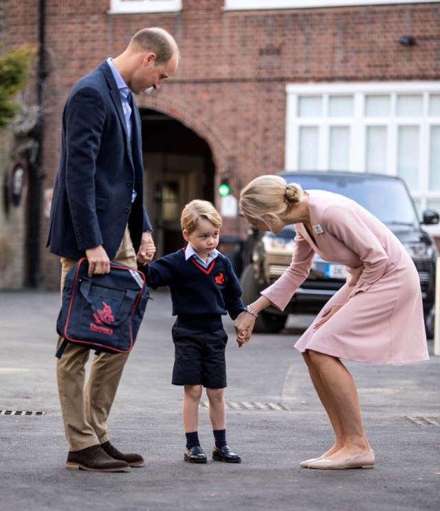 Helen Haslem, head of the lower school, greets Britain's Prince William and his son Prince George on his first day of school at Thomas's school in Battersea, London, September 7, 2017. REUTERS/Richard Pohle/Pool