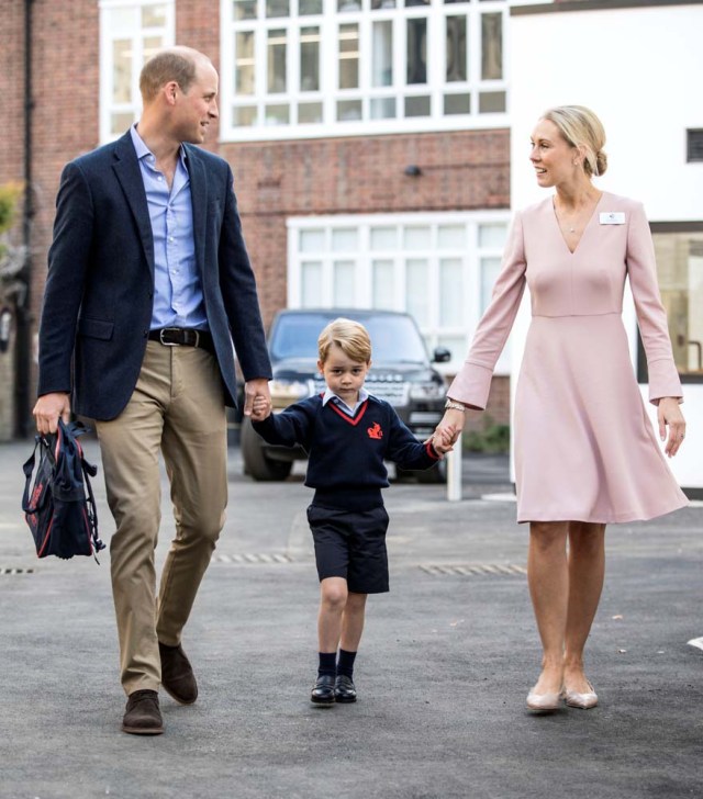Helen Haslem, head of the lower school and Britain's Prince William hold Prince George's hands as he arrives for his first day of school at Thomas's school in Battersea, London, September 7, 2017. REUTERS/Richard Pohle/Pool