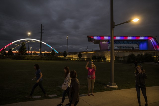 NASHVILLE, TN - OCTOBER 02: The Ascend Amphitheater and Korean Veterans Memorial Bridge in downtown Nashville, Tenn. are lit up in red, white and blue after a vigil for the victims of the mass shooting in Las Vegas on October 2, 2017 in Nashville, Tennessee. At least 58 people were killed and 500 wounded at the Route 91 Harvest Festival in Las Vegas Sunday night.   Joe Buglewicz/Getty Images/AFP