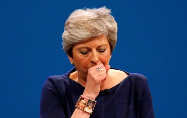 Britain's Prime Minister Theresa May coughs as she addresses the Conservative Party conference in Manchester, October 4, 2017. REUTERS/Phil Noble