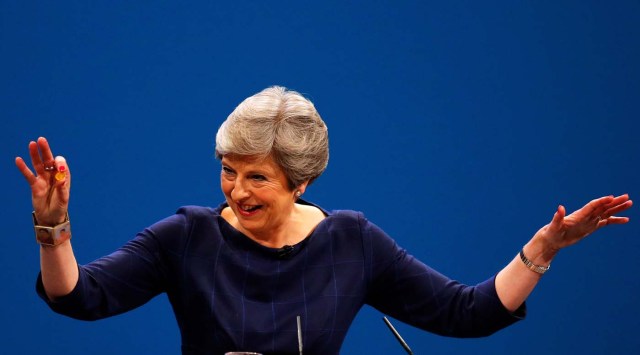 Britain's Prime Minister Theresa May holds up a cough sweet after suffering a coughing fit whilst addressing the Conservative Party conference in Manchester, October 4, 2017. REUTERS/Phil Noble