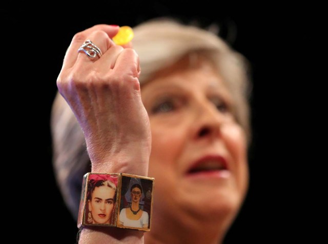 Britain's Prime Minister Theresa May wears a 'Frida Kahlo' bracelet and holds a sweet passed to her as she addresses the Conservative Party conference in Manchester, October 4, 2017. REUTERS/Hannah McKay NO RESALES. NO ARCHIVES. TPX IMAGES OF THE DAY