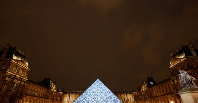 An image depicting the roof of the new Louvre Abu Dhabi museum is projected on the Louvre Pyramid in Paris, France, November 8, 2017. REUTERS/Christian Hartmann