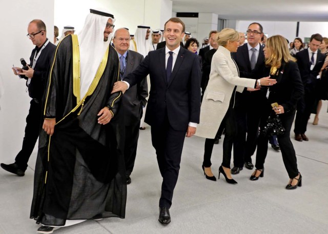 (From L-R) Chairman of Abu Dhabi's Tourism and Culture Authority Mohamad Khalifa al-Mubarak, French President Emmanuel Macron, his wife Brigitte, and Marie-Christine Saragosse, president of France Medias Monde, visit the Louvre Abu Dhabi Museum during its inauguration in Abu Dhabi, UAE, November 8, 2017. Picture taken November 8, 2017. REUTERS/Ludovic Marin