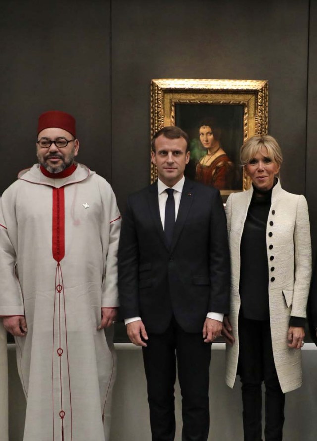French President Emmanuel Macron (C), his wife Brigitte (R) and Moroccan King Mohammed VI visit the Louvre Abu Dhabi Museum during its inauguration in Abu Dhabi, UAE, November 8, 2017. Picture taken November 8, 2017. REUTERS/Ludovic Morin/Pool