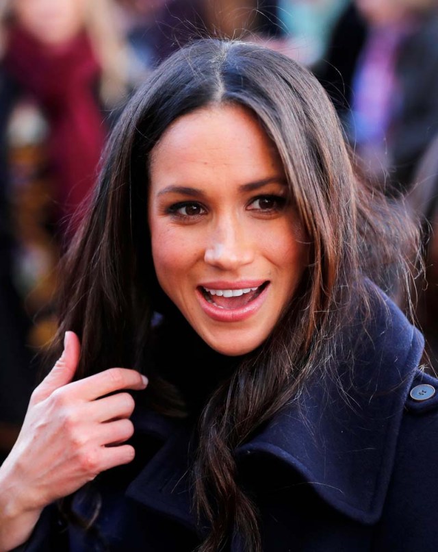 Meghan Markle greets well wishers as she arrives at an event with her fiancee Britain's Prince Harry in Nottingham, December 1, 2017. REUTERS/Eddie Keogh