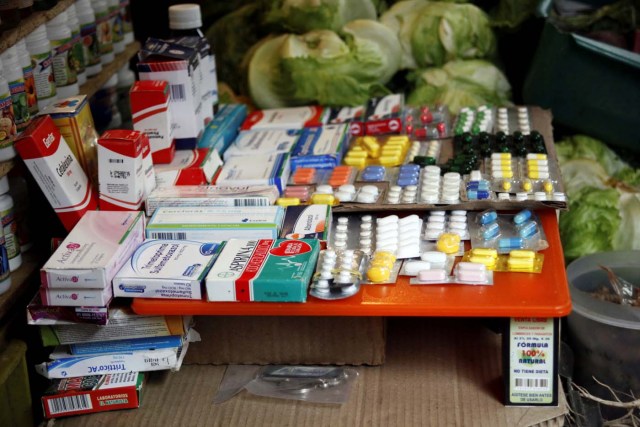 Medicines are displayed on sale in a fruit and vegetables stall at a market in Rubio, Venezuela December 5, 2017. Picture taken December 5, 2017. REUTERS/Carlos Eduardo Ramirez