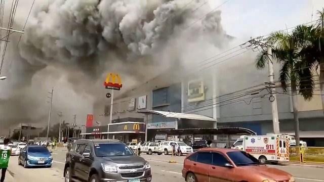 Smoke rises from burning mall's 3rd floor, in Davao City, Philippines, in this December 23, 2017 picture obtained from social media. Courtesy Otto van Dacula via REUTERS THIS IMAGE HAS BEEN SUPPLIED BY A THIRD PARTY. MANDATORY CREDIT. NO RESALES. NO ARCHIVES