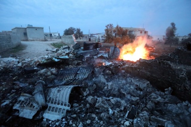 A picture taken on February 3, 2018, shows smoke billowing from the site of a downed Sukhoi-25 fighter jet near the Syrian city of Saraqib, southwest of Aleppo. Rebel fighters shot down a Russian plane over Syria's northwest Idlib province and captured its pilot, the Syrian Observatory for Human Rights said. / AFP PHOTO / OMAR HAJ KADOUR