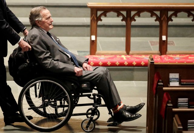FILE PHOTO: Former President George H.W. Bush, arrives at St. Martin's Episcopal Church for funeral services for former first lady Barbara Bush in Houston, Texas, U.S., April 21, 2018. David J. Phillip/Pool via Reuters/File Photo