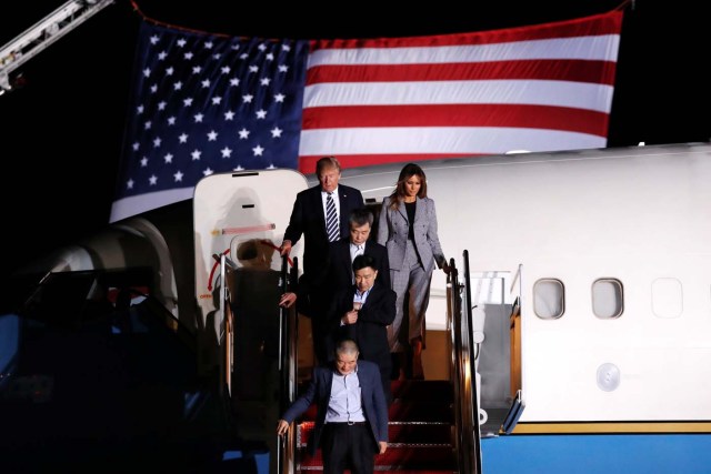 U.S. President Donald Trump and first lady Melania Trump meet the three Americans released from detention in North Korea upon their arrival at Joint Base Andrews, Maryland, U.S. May 10, 2018. REUTERS/Jonathan Ernst