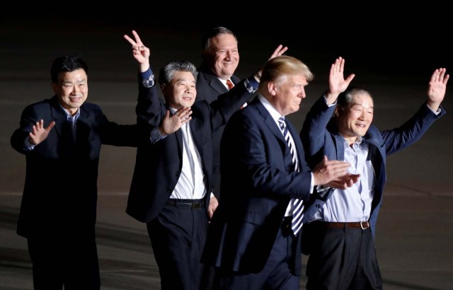 The three Americans formerly held hostage in North Korea gesture next to U.S.President Donald Trump and Secretary of State Mike Pompeo, upon their arrival at Joint Base Andrews, Maryland, U.S., May 10, 2018. REUTERS/Jim Bourg TPX IMAGES OF THE DAY