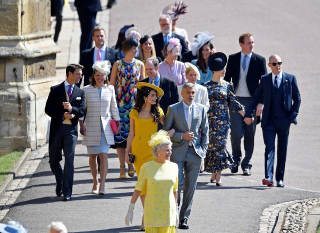 U.S. actor George Clooney and his wife, lawyer Amal Clooney arrive with guests to the wedding of Britain's Prince Harry to Meghan Markle in Windsor, Britain, May 19, 2018. REUTERS/Toby Melville/Pool