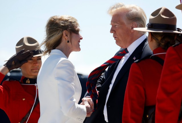 U.S. President Donald Trump is greeted as he arrives at Canadian Forces Base Bagotville, in La Baie, Quebec, Canada, June 8, 2018. REUTERS/Leah Millis
